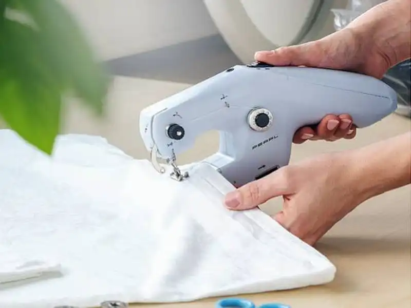 Miniompelukone, käsikäyttöinen